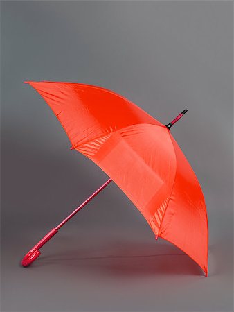 simsearch:400-08556675,k - opened red umbrella isolated on gray background Fotografie stock - Microstock e Abbonamento, Codice: 400-08013398