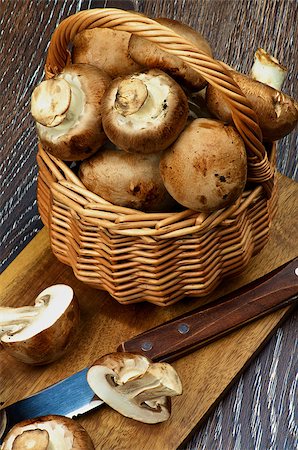 simsearch:859-03600840,k - Gourmet Raw Portabello Mushrooms Full Body and Halves in Wicker Basket with Table Knife on Cutting Board closeup on Dark Wooden background Stock Photo - Budget Royalty-Free & Subscription, Code: 400-08013580