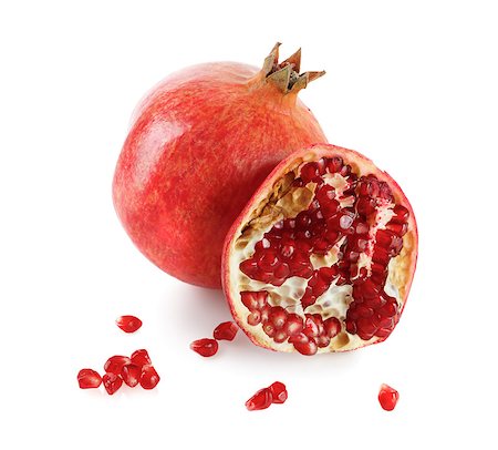 simsearch:693-08127360,k - Juicy pomegranate and its half. Isolated on white background. Photographie de stock - Aubaine LD & Abonnement, Code: 400-08013709