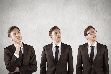 Nerdy businessman thinking against white and grey background Stock Photo - Budget Royalty-Free & Subscription, Code: 400-08020226