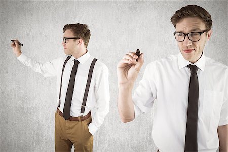 simsearch:400-08020381,k - Nerdy businessman writing against white and grey background Fotografie stock - Microstock e Abbonamento, Codice: 400-08020231