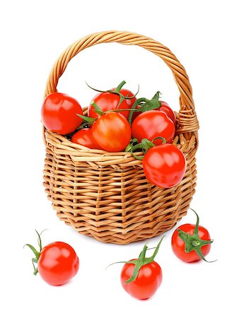 simsearch:400-06485810,k - Perfect Ripe Cherry Tomatoes with Stems in Wicker Basket isolated on white background Fotografie stock - Microstock e Abbonamento, Codice: 400-08020670