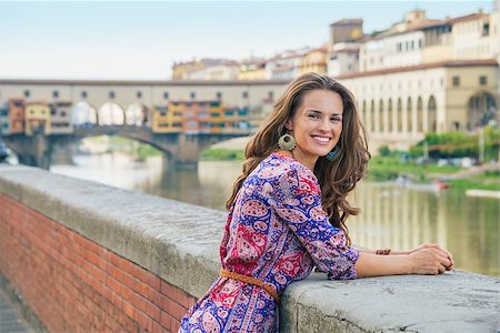 simsearch:400-08020855,k - Portrait of young woman on embankment near ponte vecchio in florence, italy Stockbilder - Microstock & Abonnement, Bildnummer: 400-08020854