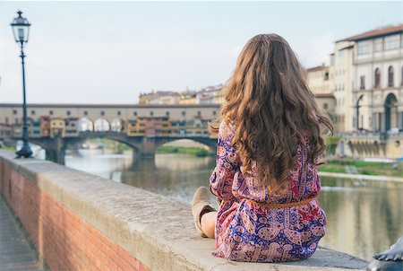 simsearch:400-08020855,k - Young woman sitting near ponte vecchio in florence, italy. rear view Foto de stock - Super Valor sin royalties y Suscripción, Código: 400-08020858