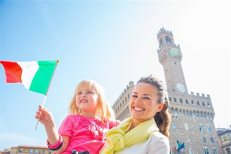 simsearch:400-07954318,k - Happy mother and baby girl with flag in front of palazzo vecchio in florence, italy Stock Photo - Budget Royalty-Free & Subscription, Code: 400-08020885