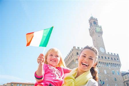 simsearch:400-07954337,k - Portrait of happy mother and baby girl with flag in front of palazzo vecchio in florence, italy Stock Photo - Budget Royalty-Free & Subscription, Code: 400-08020886