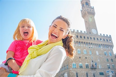 simsearch:400-08134697,k - Portrait of smiling mother and baby girl in front of palazzo vecchio in florence, italy Stock Photo - Budget Royalty-Free & Subscription, Code: 400-08020883