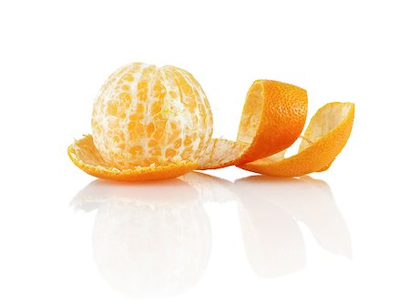 Delicious sweet juicy clementine. Peeled mandarin and peel on a white background with reflection. Isolated on white background. Fotografie stock - Microstock e Abbonamento, Codice: 400-08020958