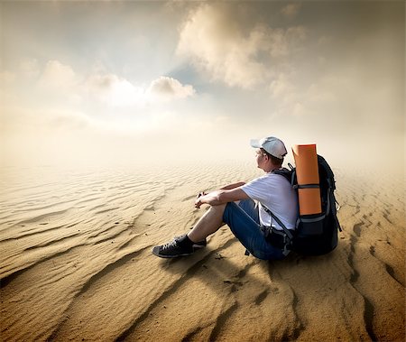 picture of thirsty man in desert - Tourist sitting in a sand desert and looking at sun Stock Photo - Budget Royalty-Free & Subscription, Code: 400-08021789