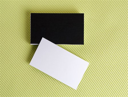 simsearch:400-06462302,k - Blank black and white business cards on a green background. Template for ID.  Isolated with clipping path. Top view. Stock Photo - Budget Royalty-Free & Subscription, Code: 400-08021940