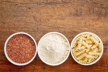 simsearch:400-07620929,k - gluten free quinoa grain, flour and pasta - top view of small ceramic bowls against rustic wood with a copy space Stock Photo - Budget Royalty-Free & Subscription, Code: 400-08022055