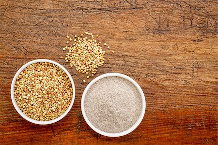 pixelsaway (artist) - gluten free buckwheat grain and flour - top view of two ceramic bowls against rustic wood with a copy space Foto de stock - Super Valor sin royalties y Suscripción, Código: 400-08022053