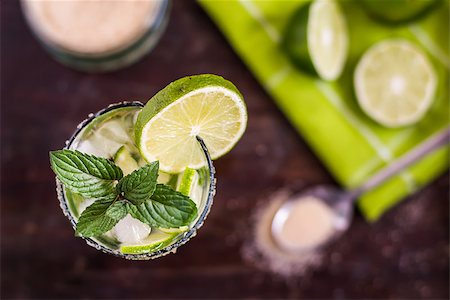 Mojito Lime Alcoholic Drink Cocktail on Wooden Table Overhead Stock Photo - Budget Royalty-Free & Subscription, Code: 400-08022092