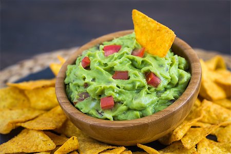 simsearch:400-06689258,k - Guacamole in Wooden Bowl with Tortilla Chips Stock Photo - Budget Royalty-Free & Subscription, Code: 400-08022576