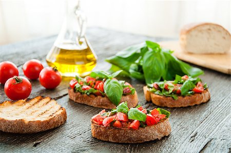 simsearch:824-02888261,k - Italian tomato bruschetta with chopped vegetables, herbs and oil on grilled or toasted crusty ciabatta bread Stock Photo - Budget Royalty-Free & Subscription, Code: 400-08034004