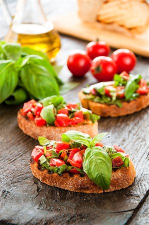 simsearch:824-02888261,k - Italian tomato bruschetta with chopped vegetables, herbs and oil on grilled or toasted crusty ciabatta bread Stock Photo - Budget Royalty-Free & Subscription, Code: 400-08034006