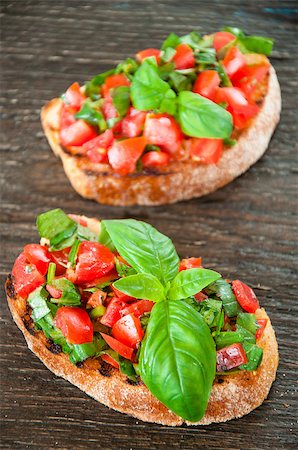 simsearch:824-02888261,k - Italian tomato bruschetta with chopped vegetables, herbs and oil on grilled or toasted crusty ciabatta bread Stock Photo - Budget Royalty-Free & Subscription, Code: 400-08034007