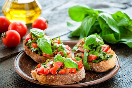 simsearch:824-02888261,k - Italian tomato bruschetta with chopped vegetables, herbs and oil on grilled or toasted crusty ciabatta bread Stock Photo - Budget Royalty-Free & Subscription, Code: 400-08034001