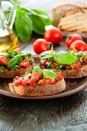 simsearch:824-02888261,k - Italian tomato bruschetta with chopped vegetables, herbs and oil on grilled or toasted crusty ciabatta bread Stock Photo - Budget Royalty-Free & Subscription, Code: 400-08034002