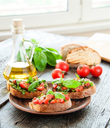 simsearch:824-02888261,k - Italian tomato bruschetta with chopped vegetables, herbs and oil on grilled or toasted crusty ciabatta bread Stock Photo - Budget Royalty-Free & Subscription, Code: 400-08034003