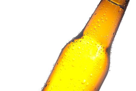 simsearch:400-07165373,k - detail of tilted bottle of fresh beer with drops, with space for text on white background Fotografie stock - Microstock e Abbonamento, Codice: 400-08034194