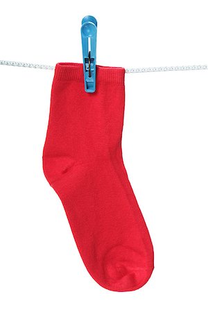 One red sock hanging on the clothesline. Image isolated on white background Stock Photo - Budget Royalty-Free & Subscription, Code: 400-08034286