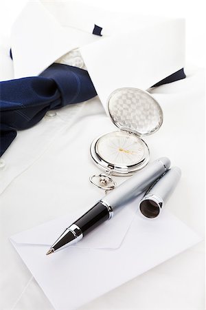 pocket watch - Elegant business still life with white dress shirt, blue tie, pen, envelope and silver pocket watch. Business concept. Stock Photo - Budget Royalty-Free & Subscription, Code: 400-08034439