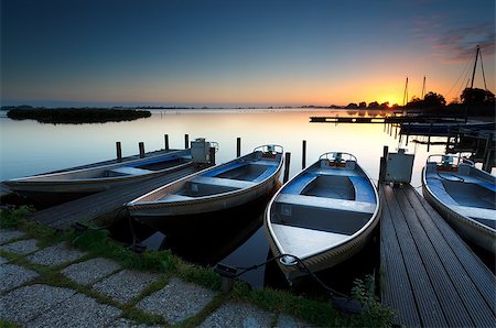 drenthe - sunrise on lake harbor with boats, Netherlands Foto de stock - Royalty-Free Super Valor e Assinatura, Número: 400-08034580