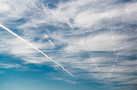 streak - Blue sky with clouds and trails of airplanes Stock Photo - Budget Royalty-Free & Subscription, Code: 400-08034642