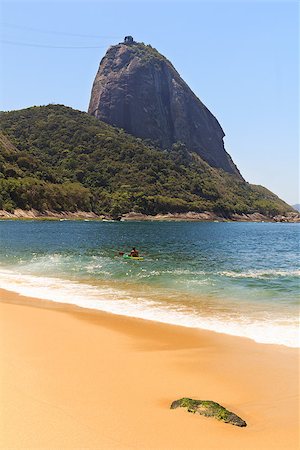 photo of empty canoe on water - Mountain Sugarloaf Red beach (Praia Vermelha) sea sand man surfing, Rio de janeiro, Brazil Stock Photo - Budget Royalty-Free & Subscription, Code: 400-08034672