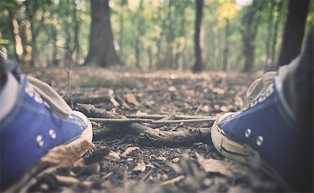 Man in sneakers in the forest Stock Photo - Budget Royalty-Free & Subscription, Code: 400-08034787