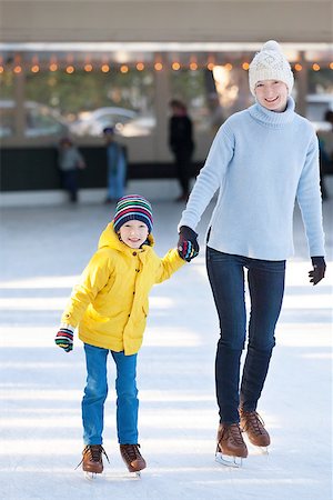 simsearch:400-08315867,k - happy mother and her little son having fun ice skating together at winter Photographie de stock - Aubaine LD & Abonnement, Code: 400-08034845
