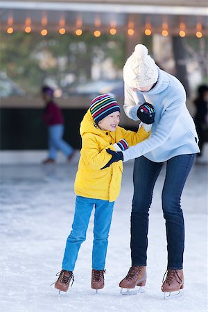simsearch:400-08318063,k - happy mother and her little son having fun ice skating together at winter Photographie de stock - Aubaine LD & Abonnement, Code: 400-08034847