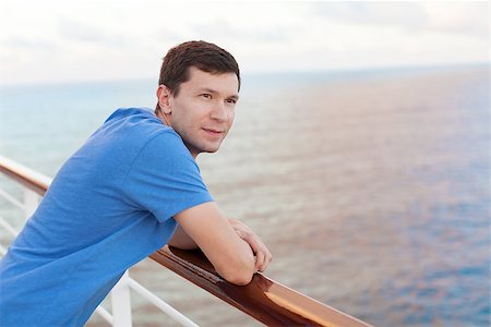 young handsome man enjoying vacation at cruise ship Stock Photo - Budget Royalty-Free & Subscription, Code: 400-08035931