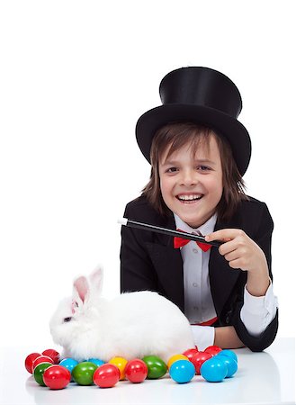 simsearch:400-08036284,k - The magic of easter - happy magician boy conjuring a grumpy rabbit and colorful eggs, isolated Stockbilder - Microstock & Abonnement, Bildnummer: 400-08036299