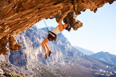 Young female rock climber on a cliff Stock Photo - Budget Royalty-Free & Subscription, Code: 400-08036334
