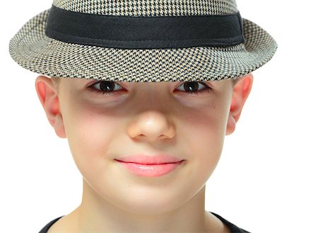 simsearch:400-08036451,k - Close-up portrait on boy clothing a hat with shadow on his eyes, on white background Stock Photo - Budget Royalty-Free & Subscription, Code: 400-08036448