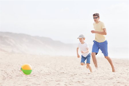 active father and his son playing with beach ball at the beach Stock Photo - Budget Royalty-Free & Subscription, Code: 400-08036473