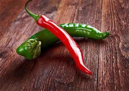 simsearch:400-07211737,k - Red and green Hot Chili Peppers over wooden background Photographie de stock - Aubaine LD & Abonnement, Code: 400-08036676