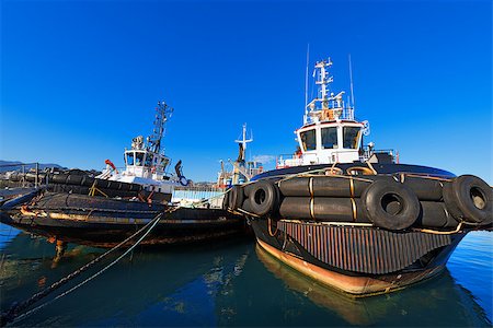 schlepper (boot) - Three tugboats docked in the harbor of La Spezia, Liguria, Italy Stockbilder - Microstock & Abonnement, Bildnummer: 400-08037124