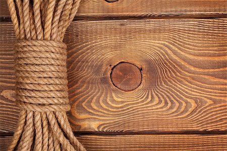 simsearch:400-04622199,k - Wooden background with marine rope and copy space Photographie de stock - Aubaine LD & Abonnement, Code: 400-08037216