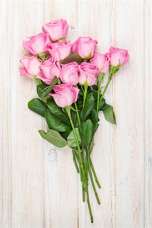 simsearch:400-08110734,k - Pink roses bouquet over white wooden table. Top view Stock Photo - Budget Royalty-Free & Subscription, Code: 400-08037277