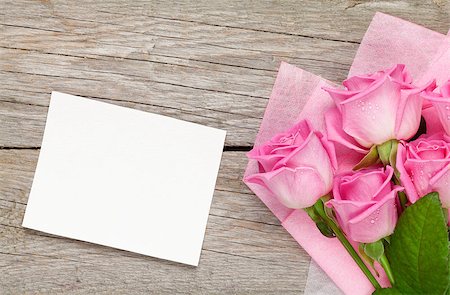 simsearch:400-08110734,k - Pink roses bouquet and blank greeting card over wooden table. Top view with copy space Stock Photo - Budget Royalty-Free & Subscription, Code: 400-08037283