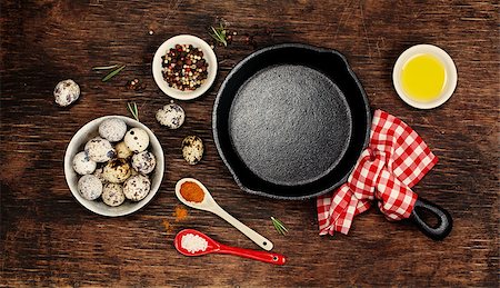 Ingredients for cooking eggs and empty iron skillet Stock Photo - Budget Royalty-Free & Subscription, Code: 400-08037372