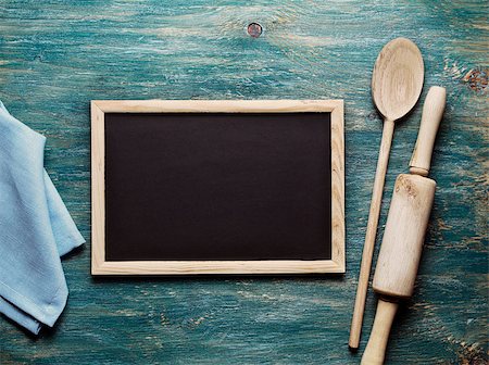 Blank black board on wooden table and kitchen tools Stock Photo - Budget Royalty-Free & Subscription, Code: 400-08037754