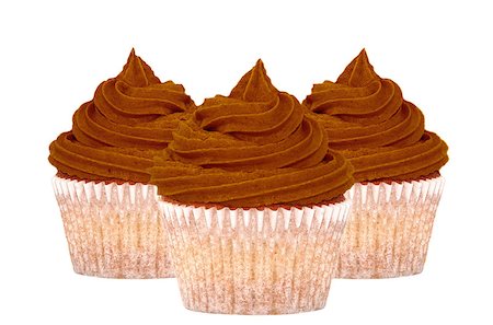 simsearch:614-03903060,k - Three chocolate cupcakes with swirls of icing, isolated on a white background Photographie de stock - Aubaine LD & Abonnement, Code: 400-08039264