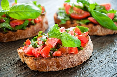 simsearch:824-02888261,k - Italian tomato bruschetta with chopped vegetables, herbs and oil on grilled or toasted crusty ciabatta bread Stock Photo - Budget Royalty-Free & Subscription, Code: 400-08031815