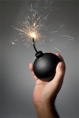 Man throwing an old-style (fake) bomb. Stock Photo - Budget Royalty-Free & Subscription, Code: 400-08031947