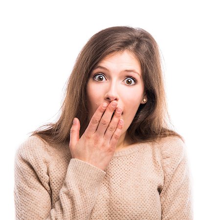 Beautiful young woman with a hand over the mouth astonished with something, isolated over white background Stock Photo - Budget Royalty-Free & Subscription, Code: 400-08032290