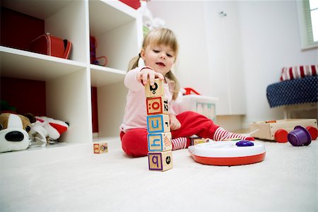 Baby girl playing in her room Stock Photo - Budget Royalty-Free & Subscription, Code: 400-08032412